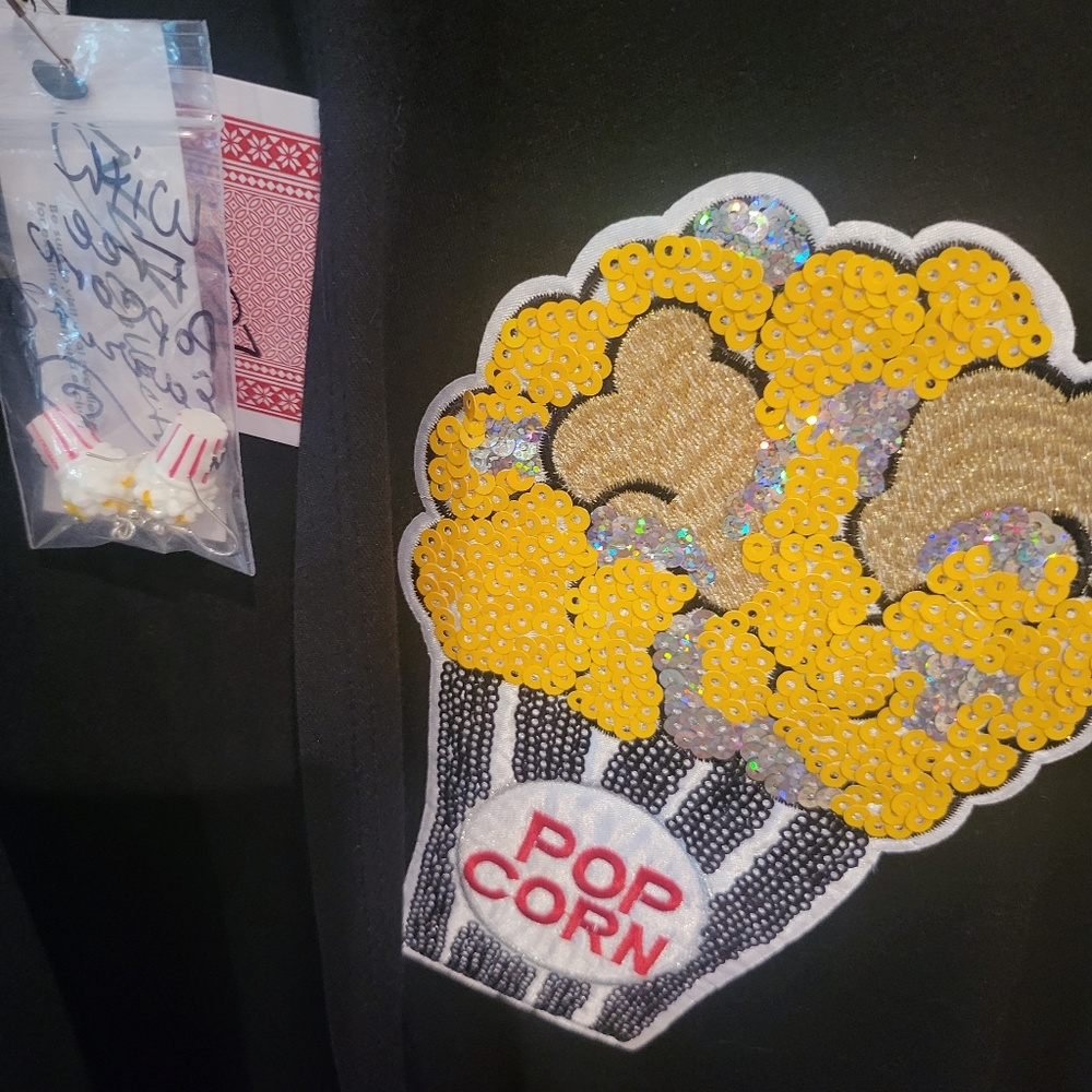 Black cardigan with sequin popcorn embellishments.  Free popcorn earrings!